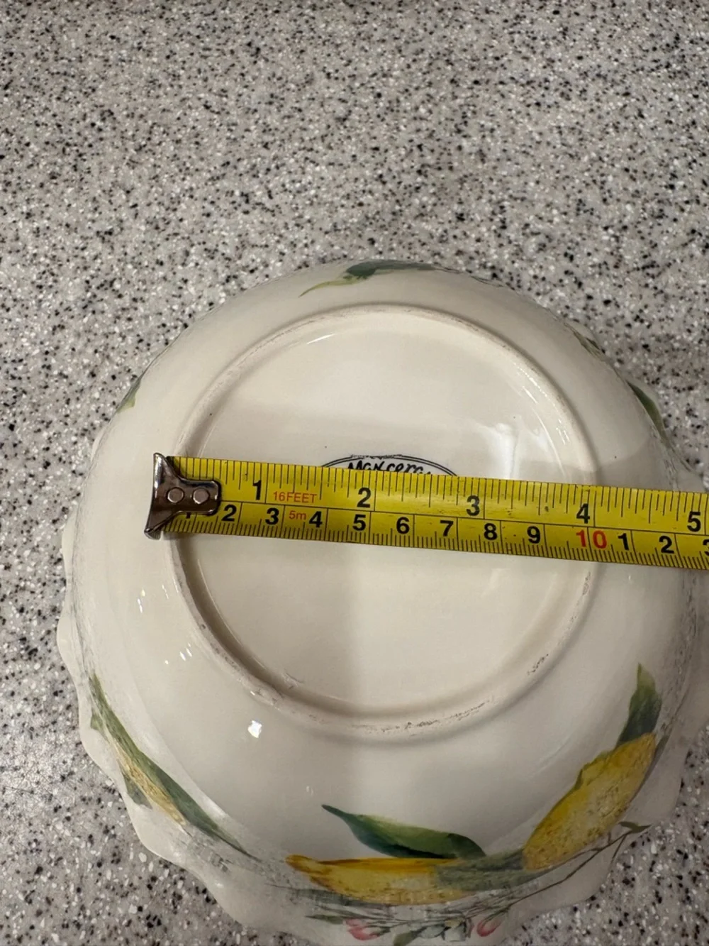 Hand-painted ceramic ruffle bowl featuring lemon motifs. Never Used. Display